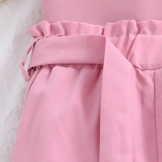 Get ready for a playful autumn with our Girls Pink Ruffled V-Neck Top and Pink Shorts!