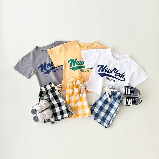 Dress your little guy in style with our Summer Newborn Boys Short Sleeved T-shirt and Checkered Shorts set!