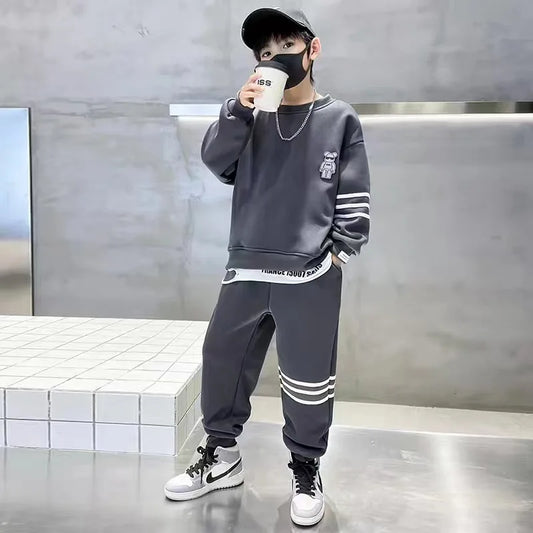 Keep your little one cozy and cute this autumn with this playful Boys Autumn Teddy Bear Striped Sweatshirt and Pants set.