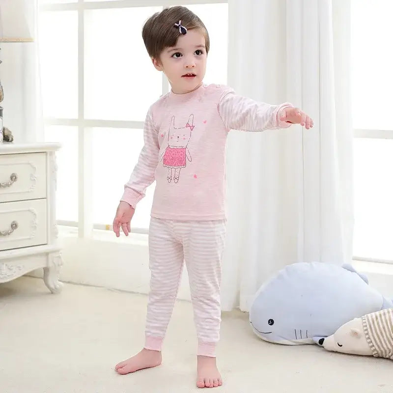 Keep your little one cozy and cute with this Toddler Kids Long Sleeve Cartoon Sleepwear 2PC Set. Made from soft cotton, these pajamas fit true to size