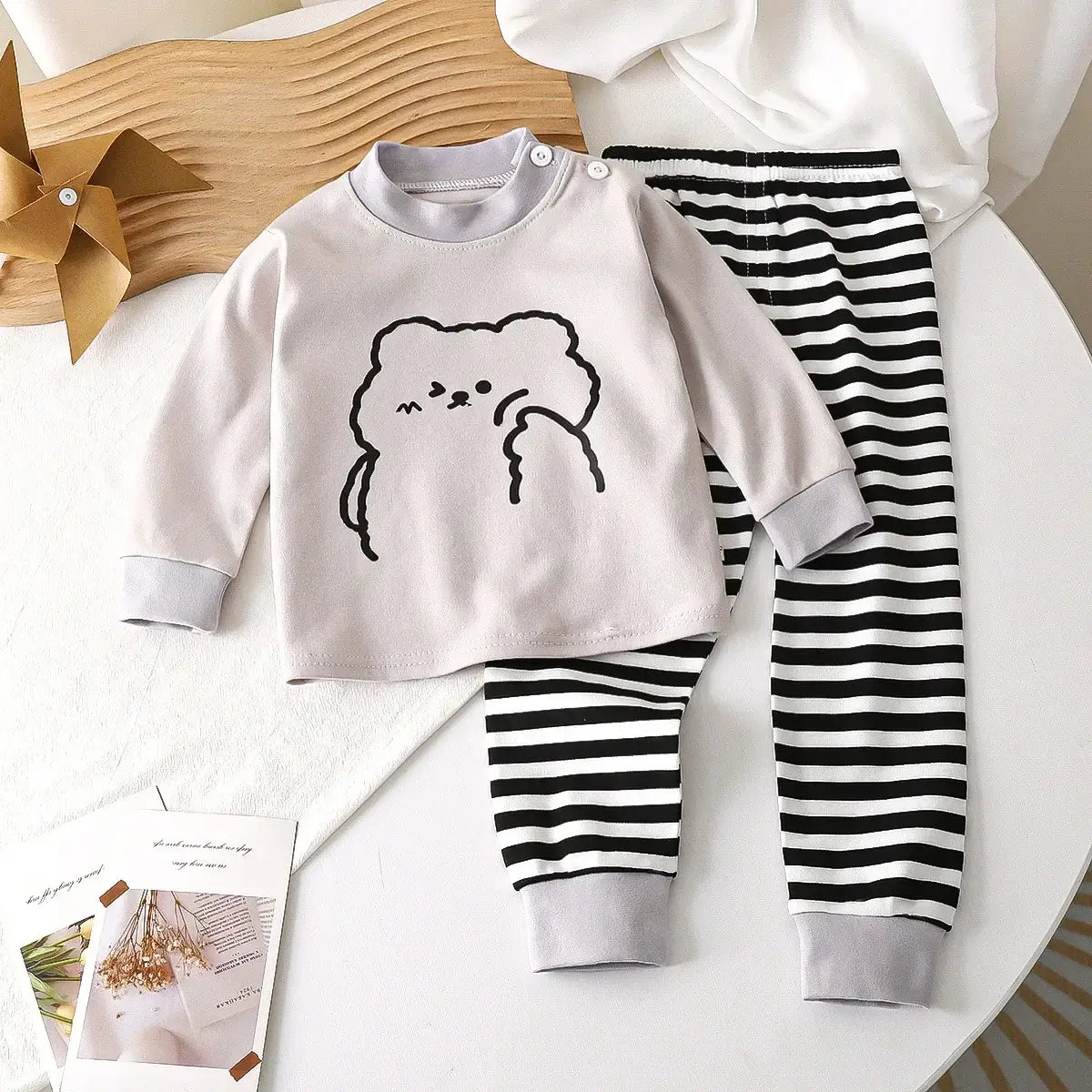Keep your little one cozy and cute in this Autumn Toddlers Long Sleeve 2PC Pajama Set. Made from soft combed cotton, this Autumn Toddlers Long Sleeve 2PC Pajama Set is breathable enough to keep skin happy and irritation-free—because cranky jammies are no