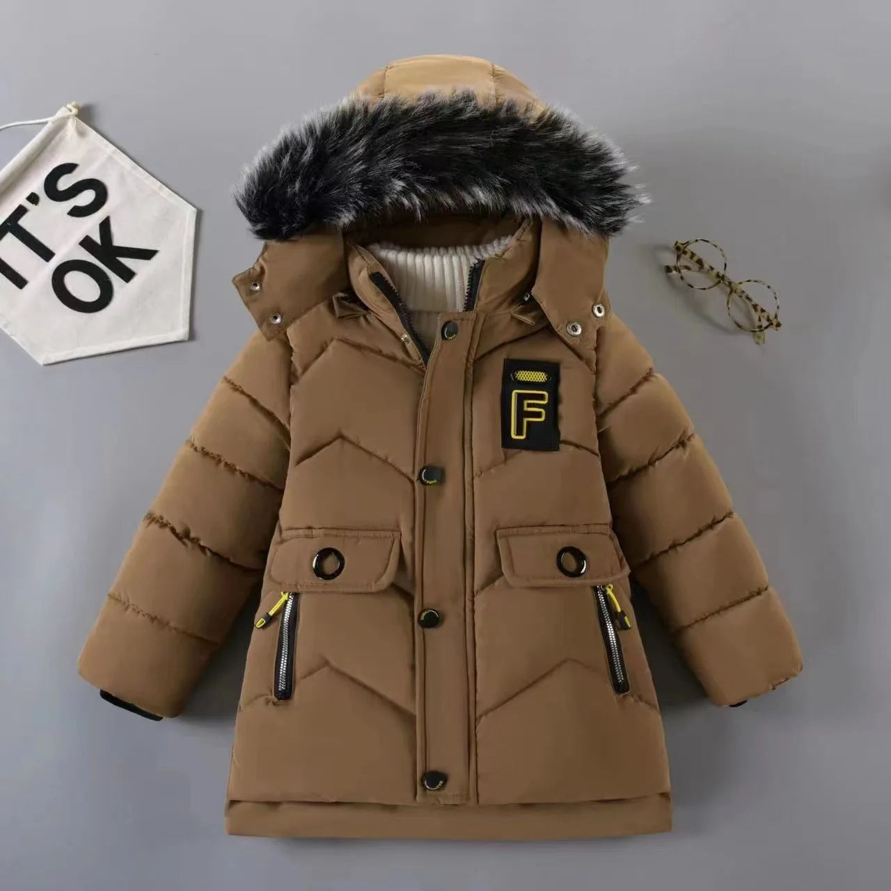 Stay warm and stylish this winter with our Winter Boys Solid Color Hooded Down Coat!