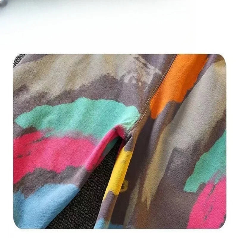 Dress your little one in this playful Toddler Boys Fashion Graffiti Sweater and Pants 2PC Set featuring a colorful graffiti print sweater and matching pants. 