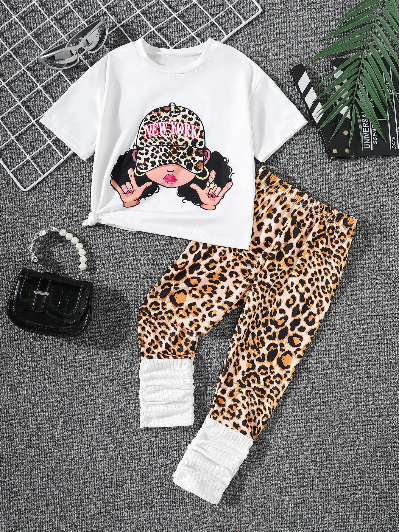 Get your little girl ready for the season with this quirky and fun Spring Girls Short Sleeved Shirt with Leopard Print Pants.