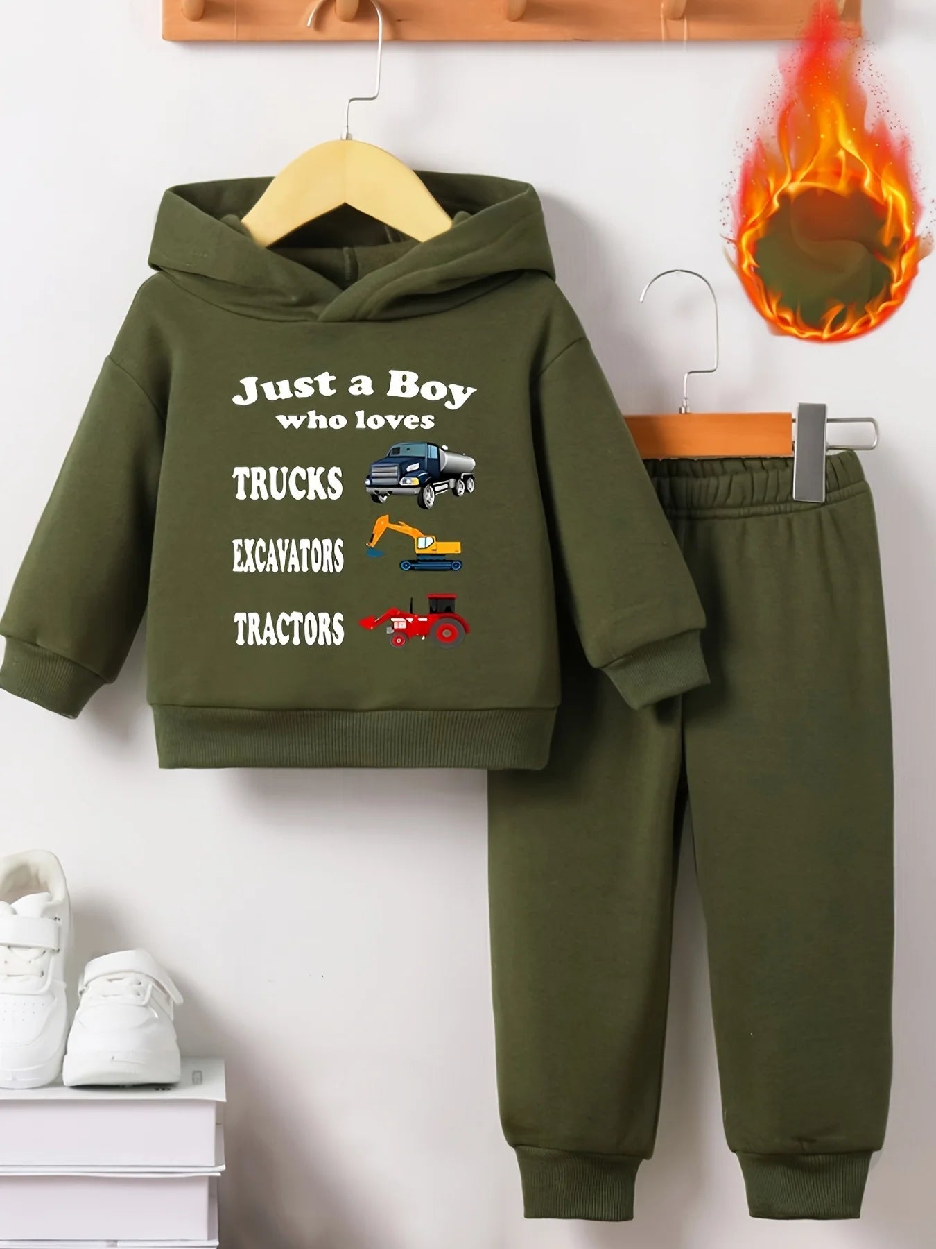 Your little man will love snuggling into this adorable Toddler Boys JUST A BOY Printed Fleece Sweatsuit—think of it as wearable comfort.