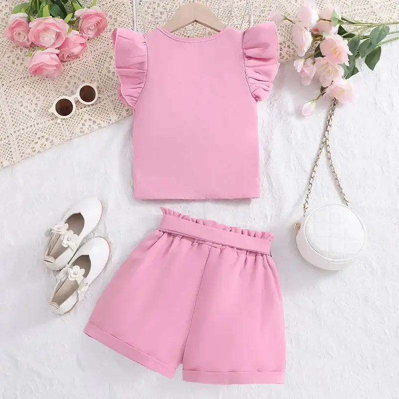 Get ready for a playful autumn with our Girls Pink Ruffled V-Neck Top & Pink Shorts!