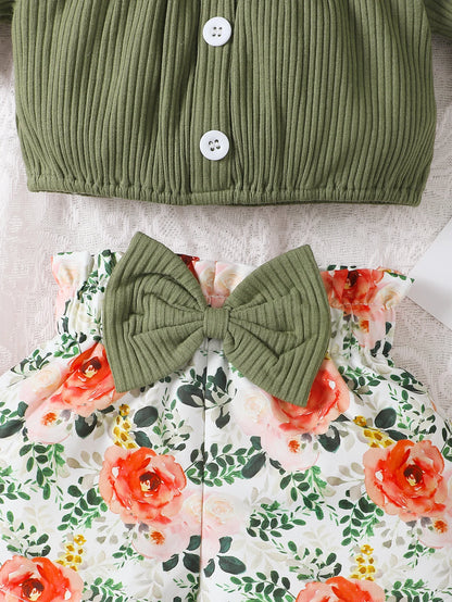 Get your little girl ready for summer with this playful set! Featuring a short-sleeved top, headscarf, and floral bow shorts.