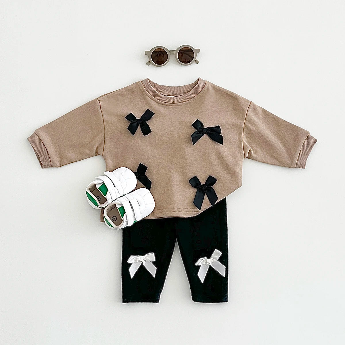 Get your little fashionista ready for spring with this stylish Bow Top and pants set.