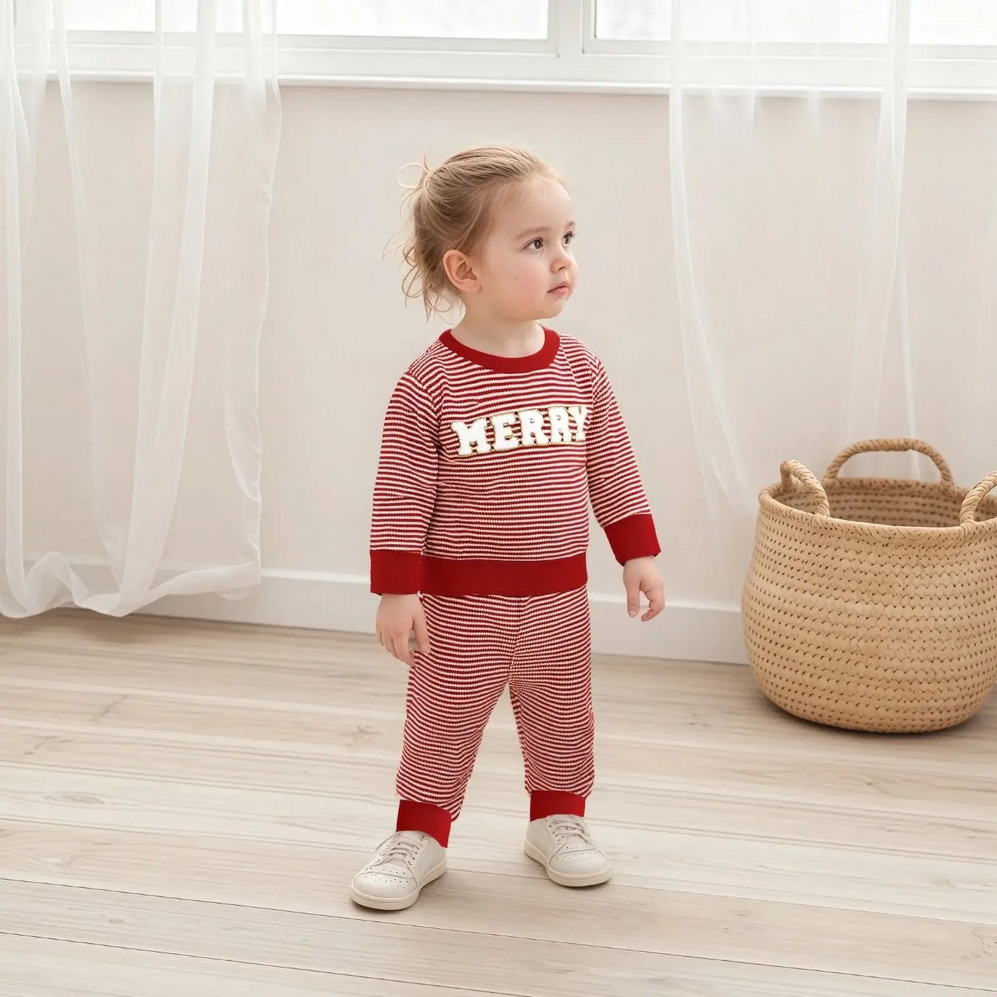 Get ready for the Newborn-Infants Christmas Striped Sweatshirt-Elastic Pants! This set features a long-sleeve sweatshirt paired with comfy elastic-waist pants. 