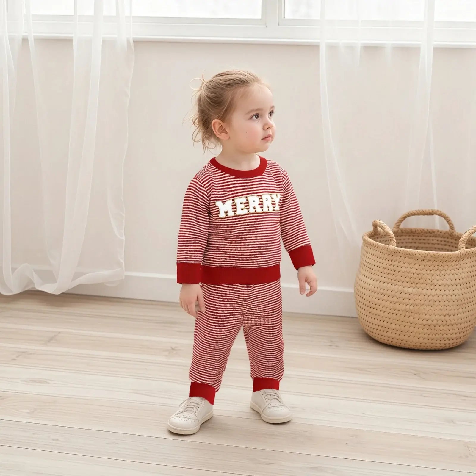 Get ready for the Newborn-Infants Christmas Striped Sweatshirt-Elastic Pants! This set features a long-sleeve sweatshirt paired with comfy elastic-waist pants. 