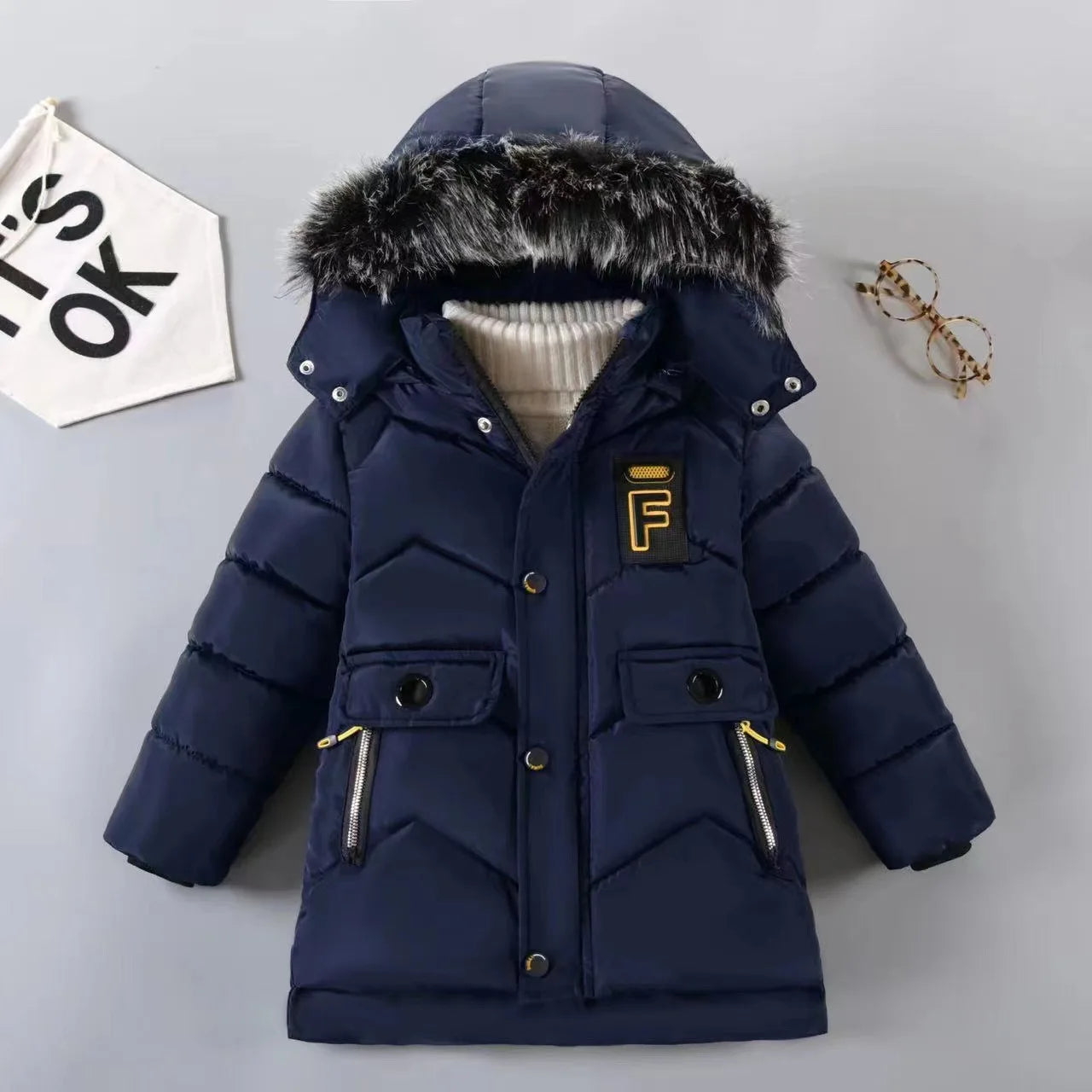 Stay warm and stylish this winter with our Winter Boys Solid Color Hooded Down Coat!