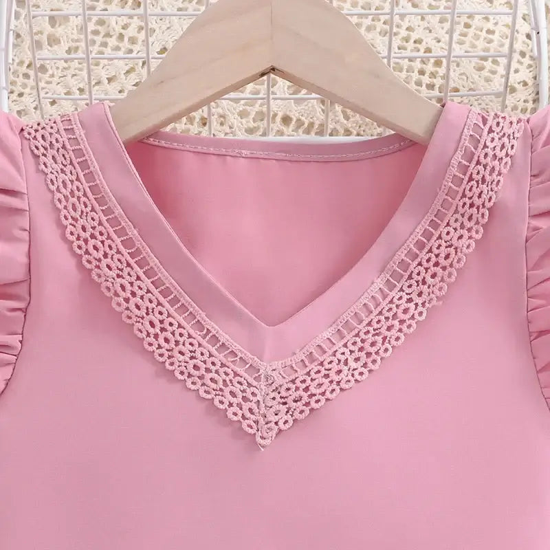 Get ready for a playful autumn with our Girls Pink Ruffled V-Neck Top & Pink Shorts!