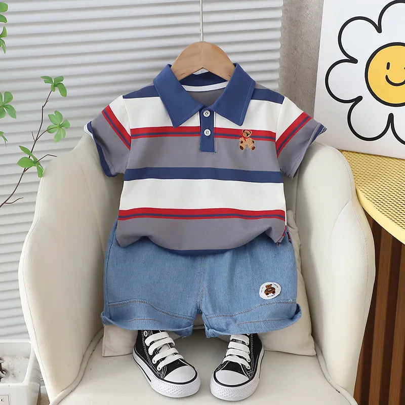 Get your little boy ready for summer with our Summer Toddler Boys Striped Bear Polo Shirt and Denim Shorts set.