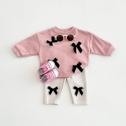 Get your little fashionista ready for spring with this stylish Bow Top and pants set.