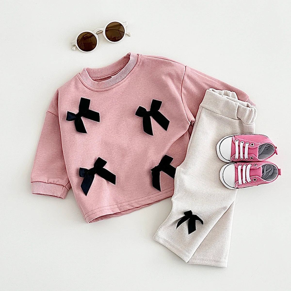 Get your little fashionista ready for spring with this stylish Bow Top and pants set.