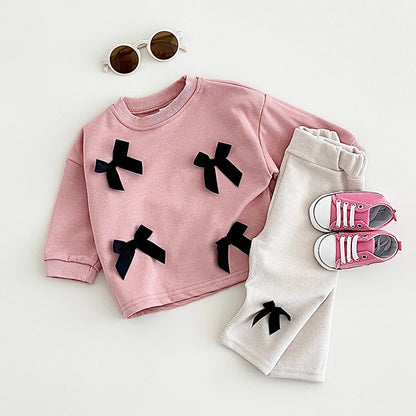 Get your little fashionista ready for spring with this stylish Bow Top and pants set.