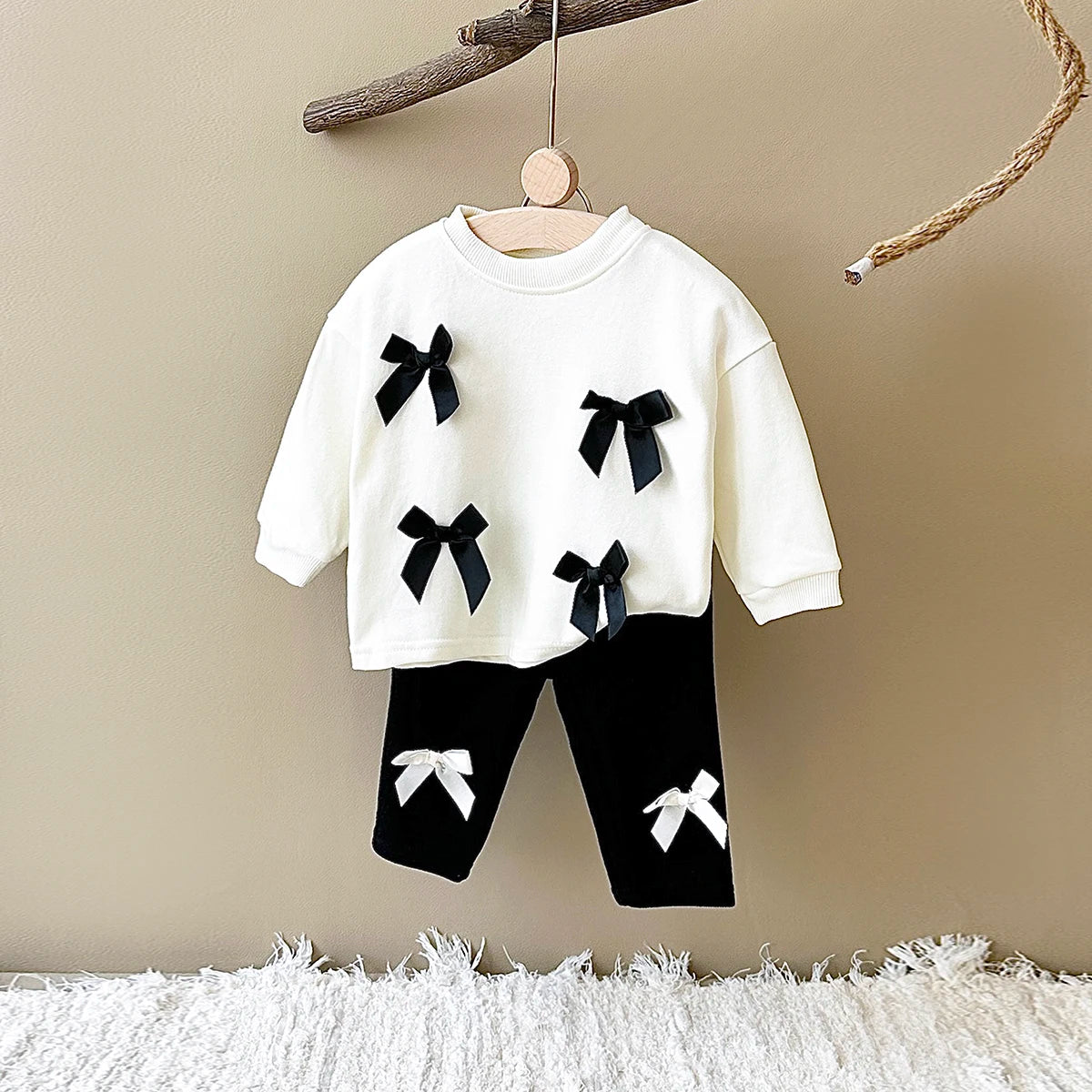 Get your little fashionista ready for spring with this stylish Bow Top and pants set.