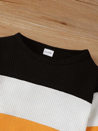 Keep your little one cozy and stylish this autumn with this playful Toddler Boys Autumn Color Block Top and Pants. Made from soft cotton and polyester blend