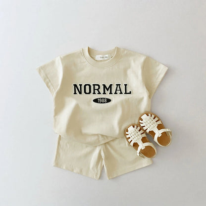 Get ready to have some FUN in the sun with our Summer Toddler Boys NORMAL Shorts Set!