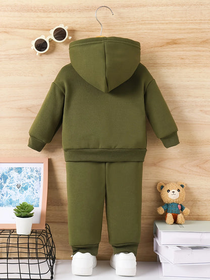 Your little man will love snuggling into this adorable Toddler Boys JUST A BOY Printed Fleece Sweatsuit—think of it as wearable comfort.