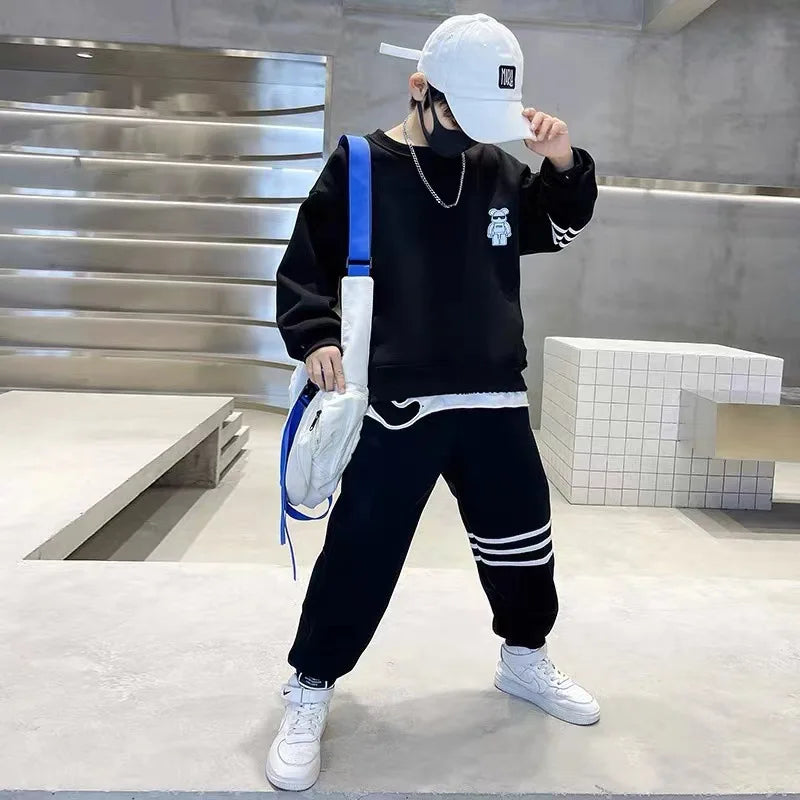 Keep your little one cozy and cute this autumn with this playful Boys Autumn Teddy Bear Striped Sweatshirt and Pants set. 