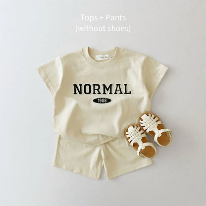 Get ready to have some FUN in the sun with our Summer Toddler Boys NORMAL Shorts Set!