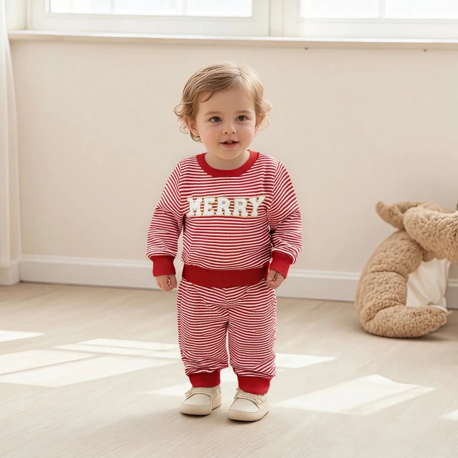 Get ready for the Newborn-Infants Christmas Striped Sweatshirt-Elastic Pants! This set features a long-sleeve sweatshirt paired with comfy elastic-waist pants. 
