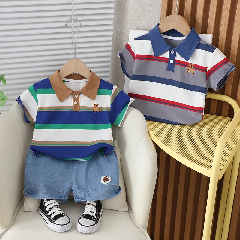 Get your little boy ready for summer with our Summer Toddler Boys Striped Bear Polo Shirt and Denim Shorts set.