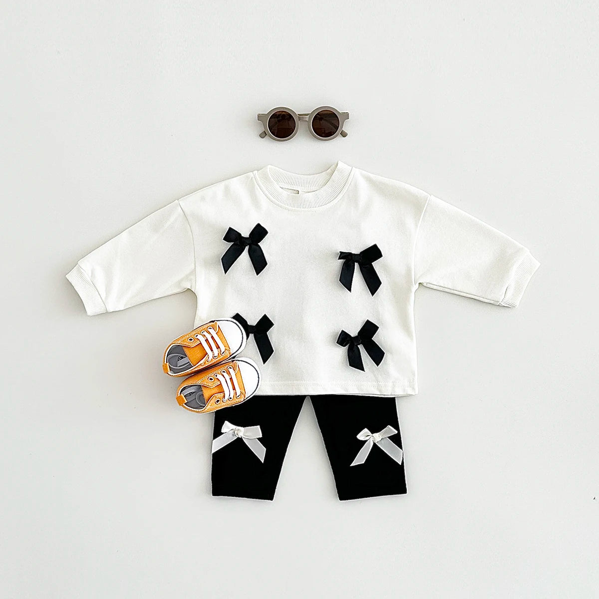 Get your little fashionista ready for spring with this stylish Bow Top and pants set.