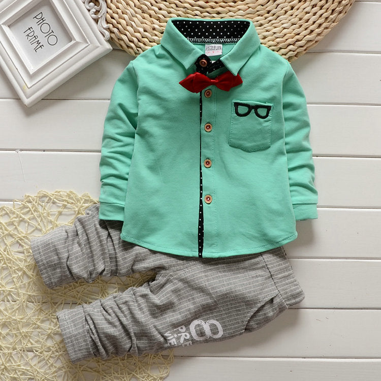 Dress your toddler to impress with this stylish long-sleeve, button-up shirt with bow tie and matched pants!