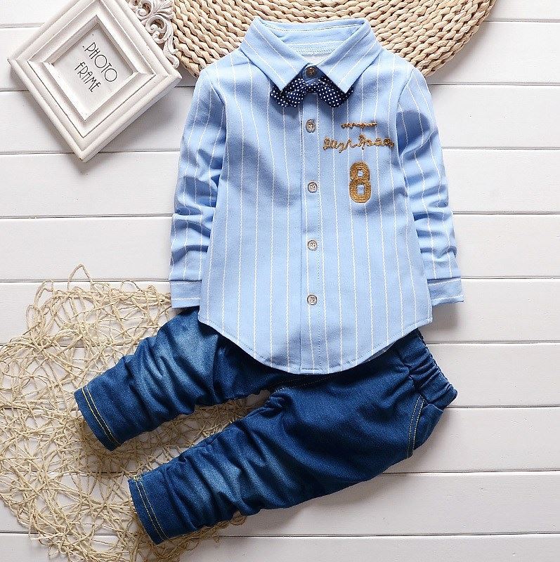 Dress your toddler to impress with this stylish long-sleeve, button-up shirt with bow tie and matched pants!