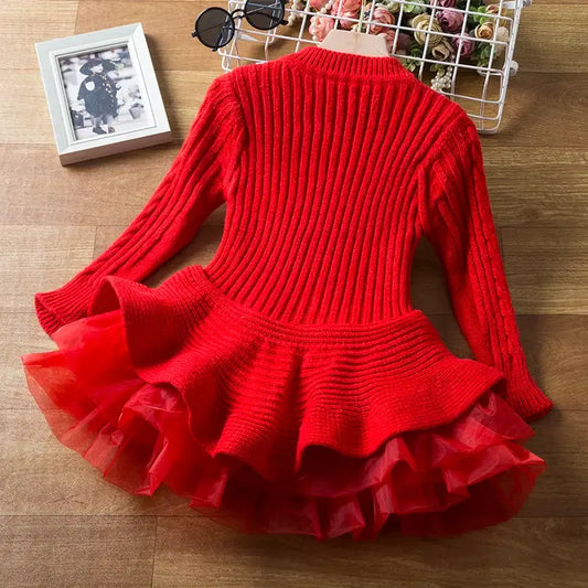Keep your little one cozy and cute in this Girls Winter Long Sleeve Knitted Sweater Dress! Made from a comfy blend of cotton, polyester, and viscose, 