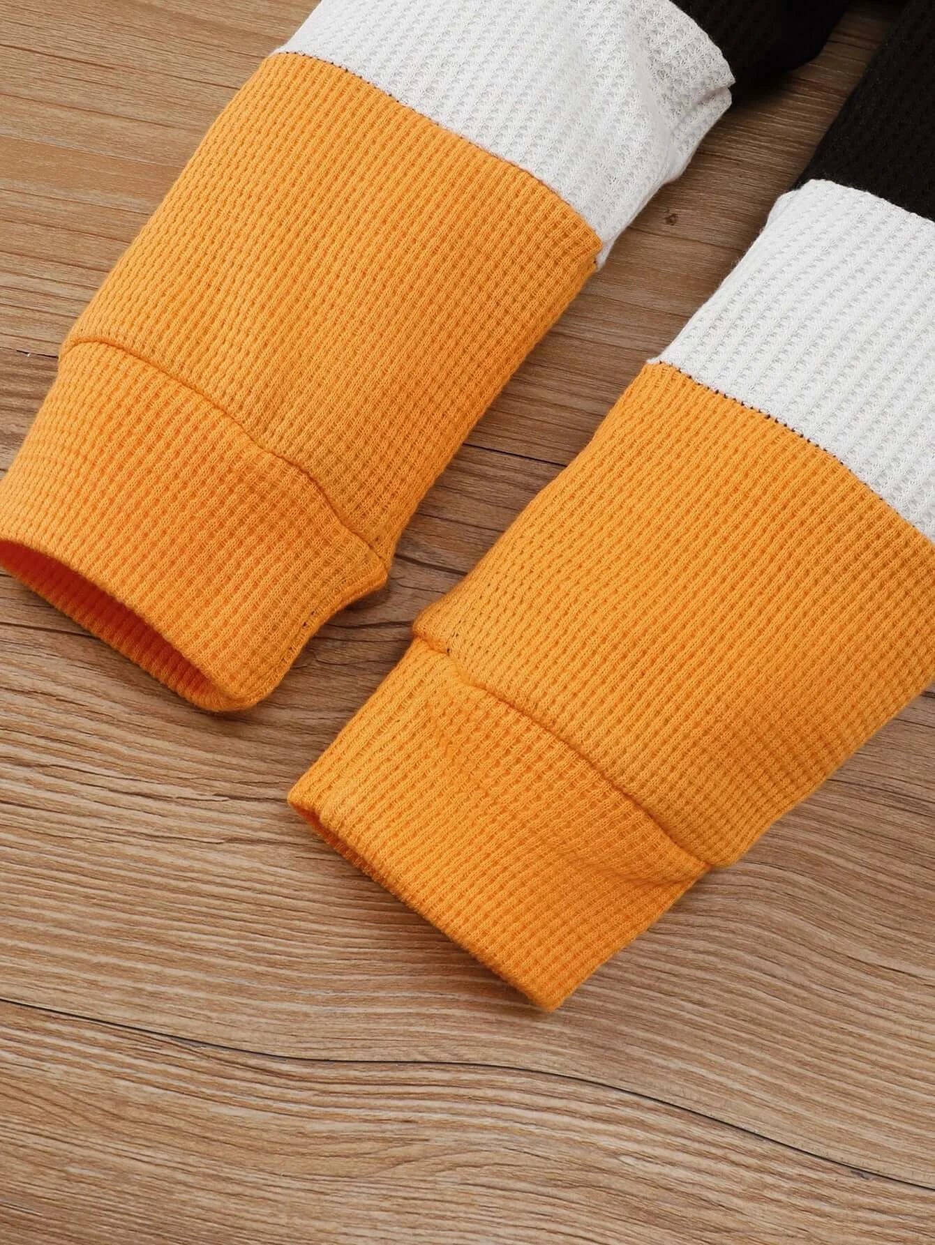 Keep your little one cozy and stylish this autumn with this playful Toddler Boys Autumn Color Block Top and Pants. Made from soft cotton and polyester blend