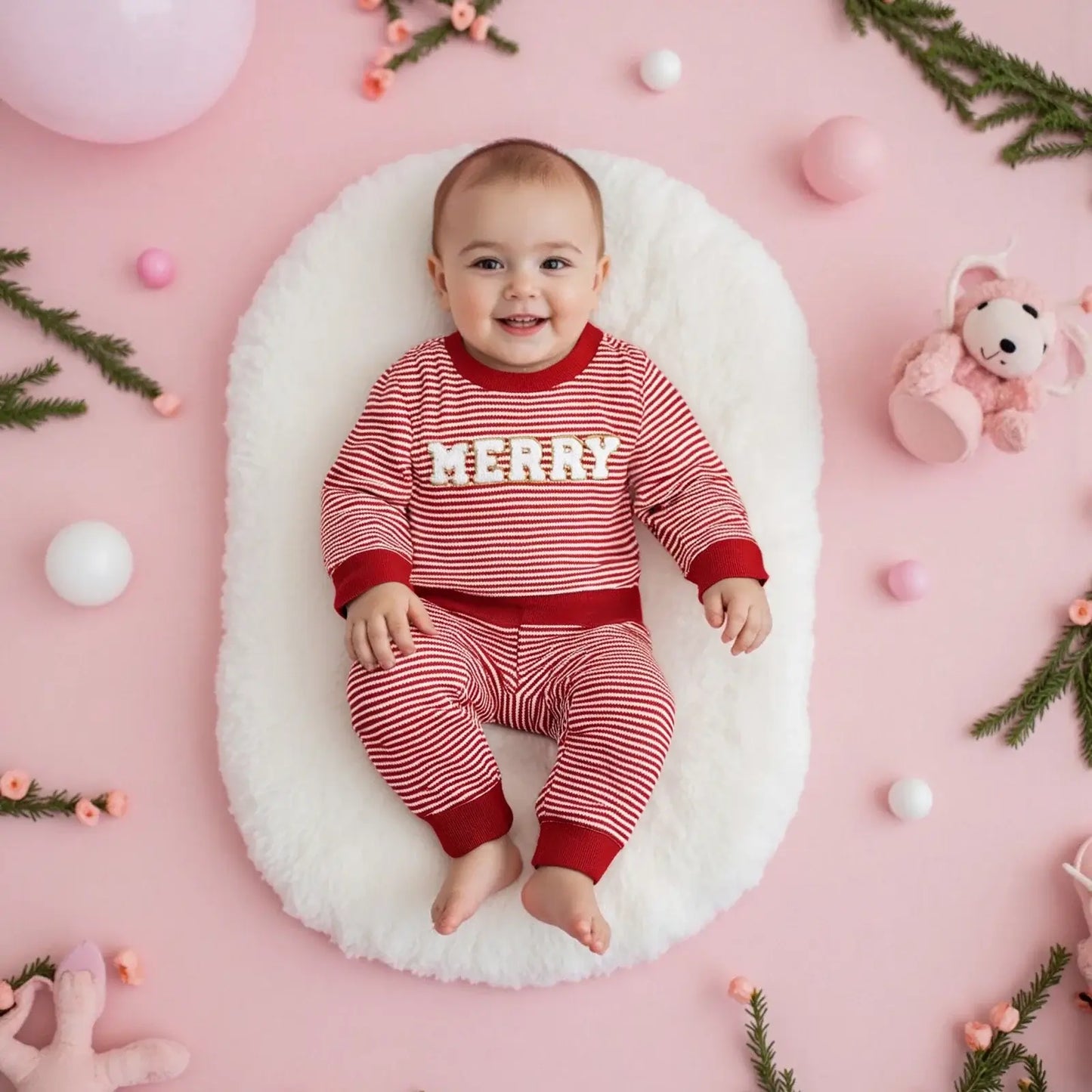 Get ready for the Newborn-Infants Christmas Striped Sweatshirt-Elastic Pants! This set features a long-sleeve sweatshirt paired with comfy elastic-waist pants. 