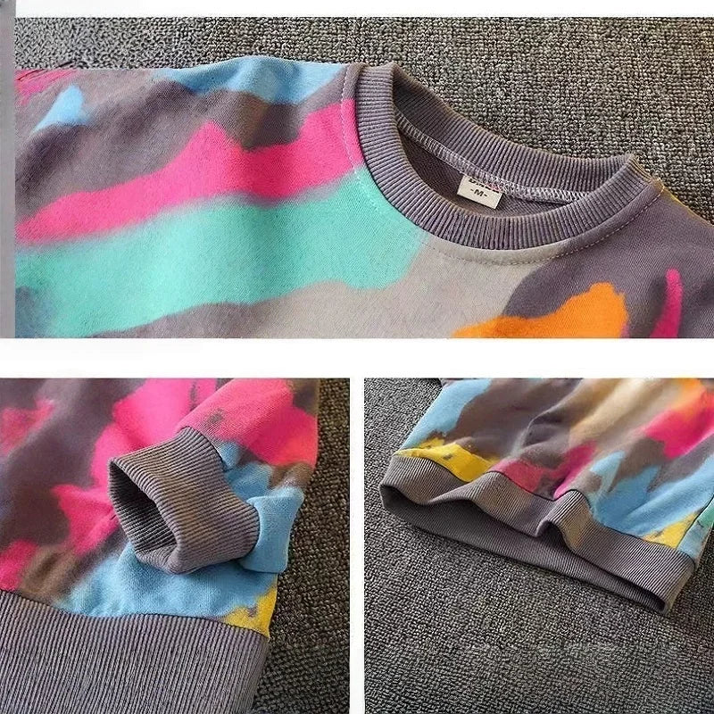 Dress your little one in this playful Toddler Boys Fashion Graffiti Sweater and Pants 2PC Set featuring a colorful graffiti print sweater and matching pants. 