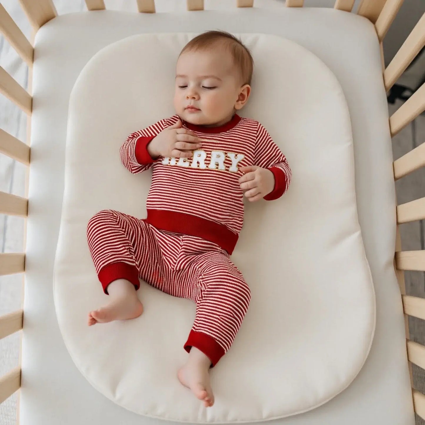 Get ready for the Newborn-Infants Christmas Striped Sweatshirt-Elastic Pants! This set features a long-sleeve sweatshirt paired with comfy elastic-waist pants. 