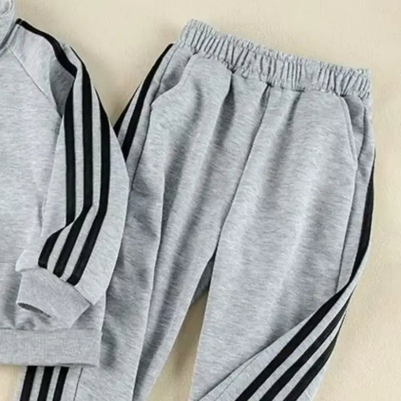 Get your little champ ready for action with this Boys Autumn Striped Sport Jacket and Matching Pants!