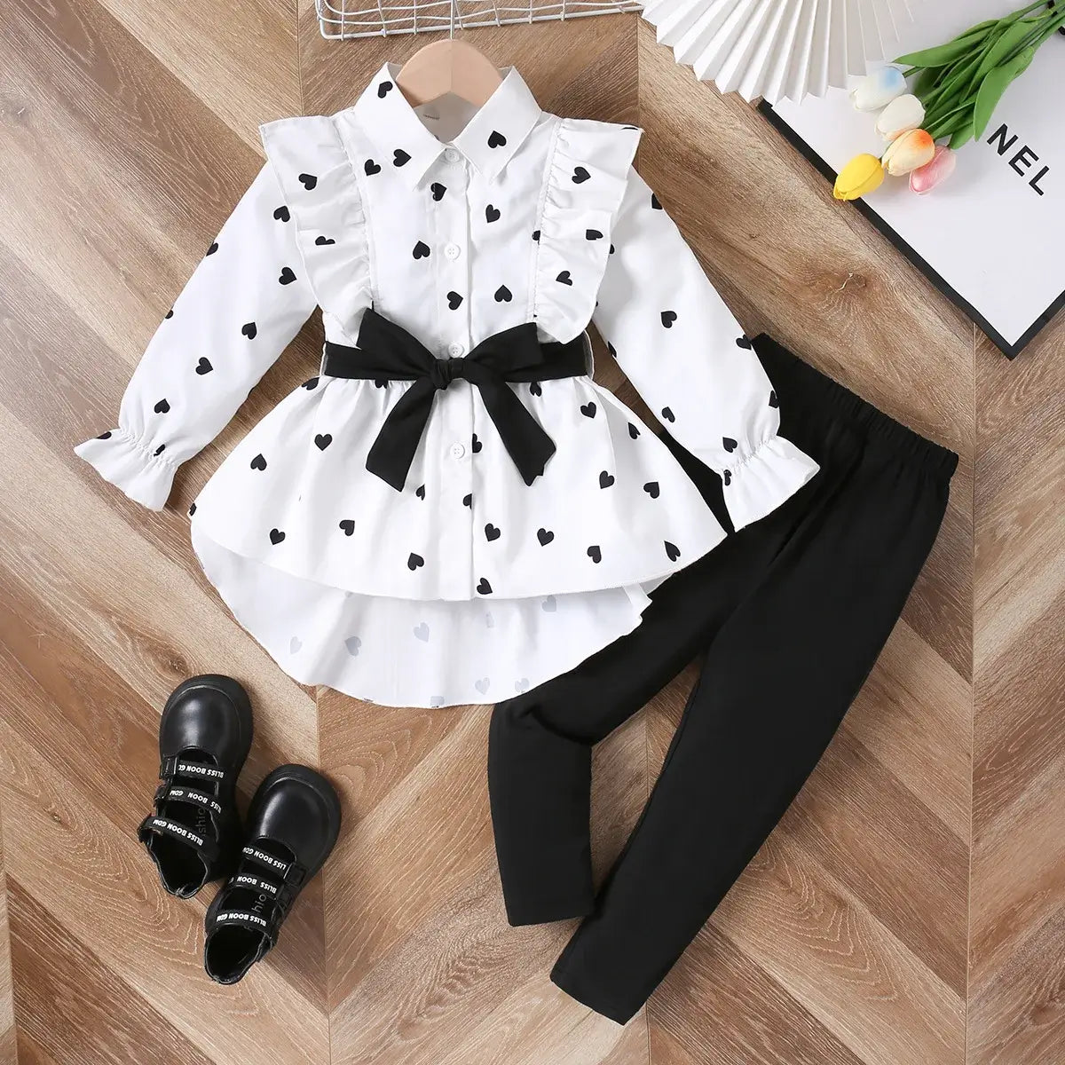 This adorable outfit features a long shirt dress and pants that will make your little girl stand out.