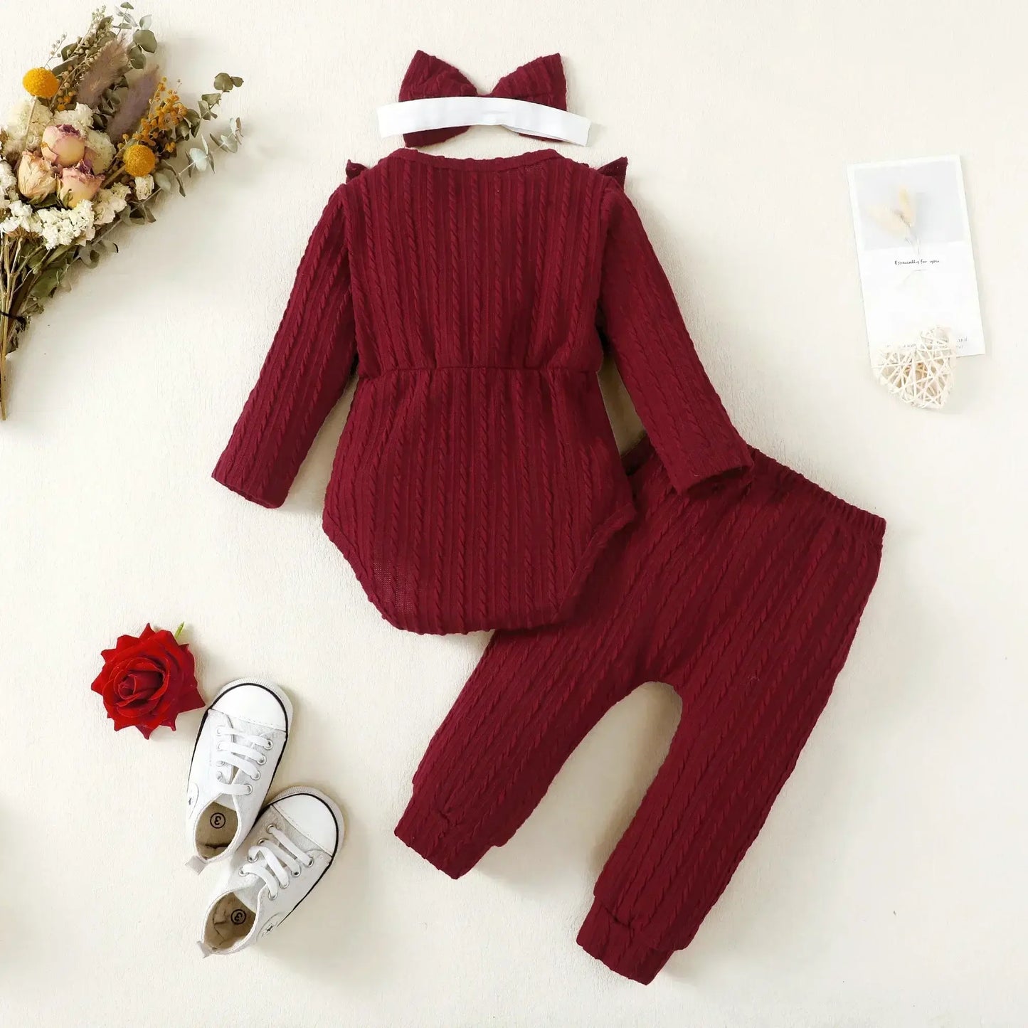 This autumn, dress your newborn girl in style with our long sleeve romper and pants set.