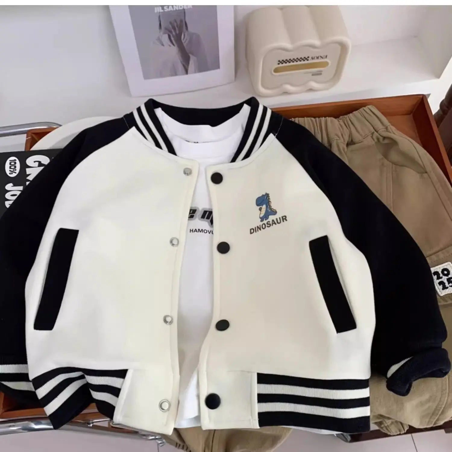 Gear up your little roarsome dinosaur for autumn adventures with this Toddler Boys Baseball Jacket! 