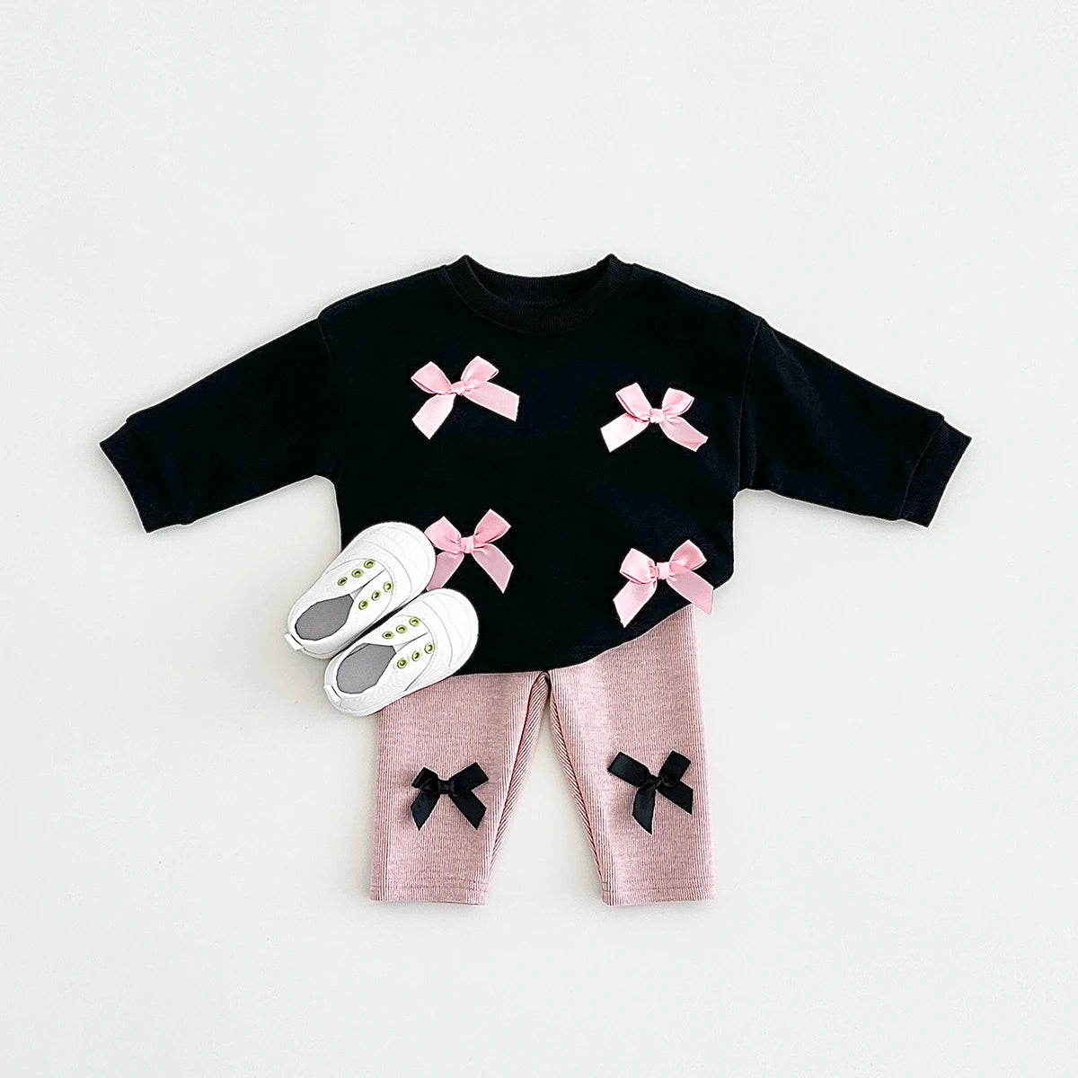 Get your little fashionista ready for spring with this stylish Bow Top and pants set.