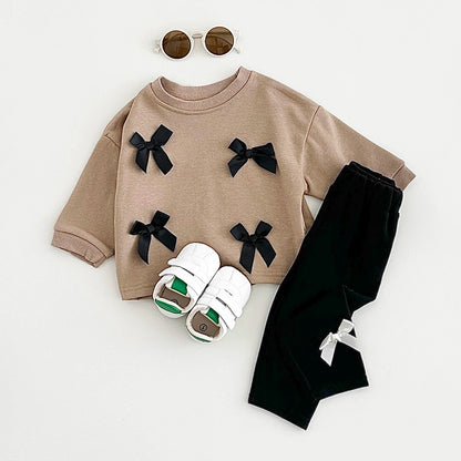 Get your little fashionista ready for spring with this stylish Bow Top and pants set.