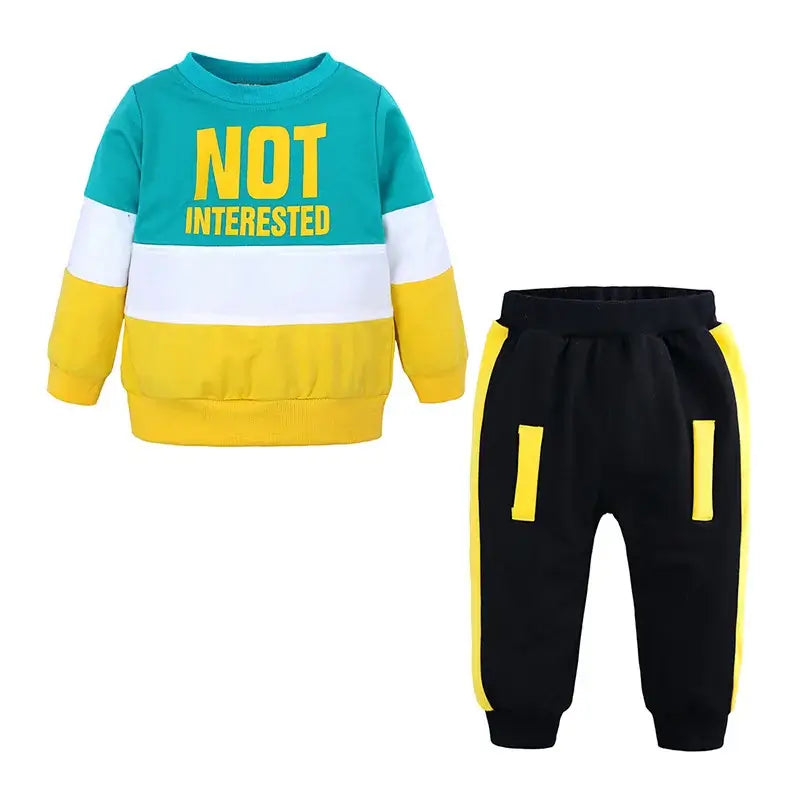 Introducing our Autumn Toddler Boys NOT INTERESTED Tracksuit, perfect for your little one's active days.