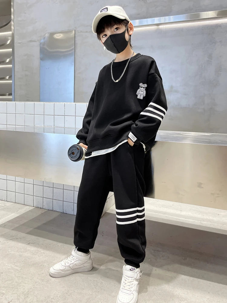 Keep your little one cozy and cute this autumn with this playful Boys Autumn Teddy Bear Striped Sweatshirt and Pants set. 