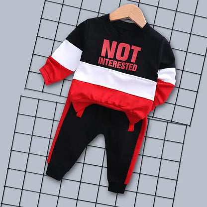 Introducing our Autumn Toddler Boys NOT INTERESTED Tracksuit, perfect for your little one's active days.