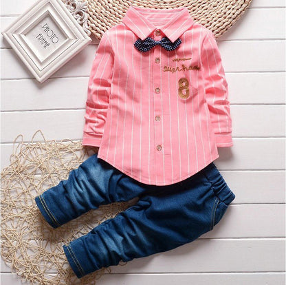 Dress your toddler to impress with this stylish long-sleeve, button-up shirt with bow tie and matched pants!