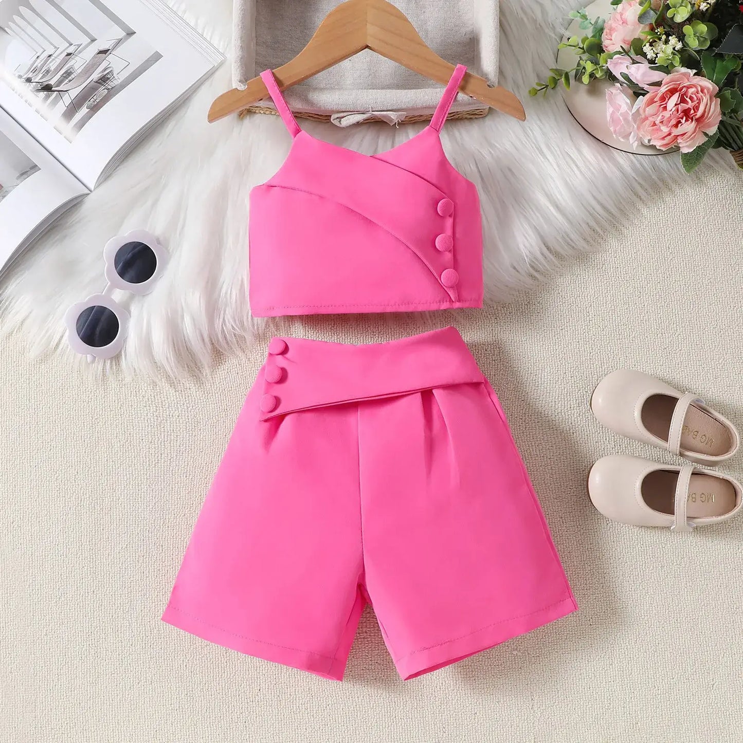 Get your little girl ready in style with our Toddler Girls Fashion Side Button Strap Top & Shorts set!