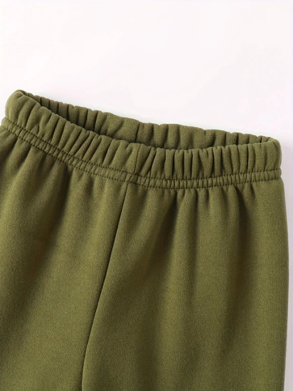 Your little man will love snuggling into this adorable Toddler Boys JUST A BOY Printed Fleece Sweatsuit—think of it as wearable comfort.