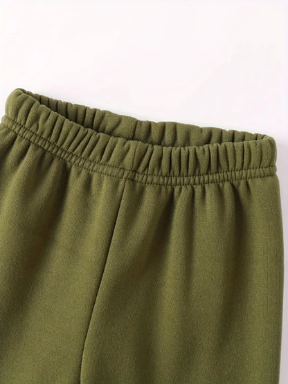 Your little man will love snuggling into this adorable Toddler Boys JUST A BOY Printed Fleece Sweatsuit—think of it as wearable comfort.