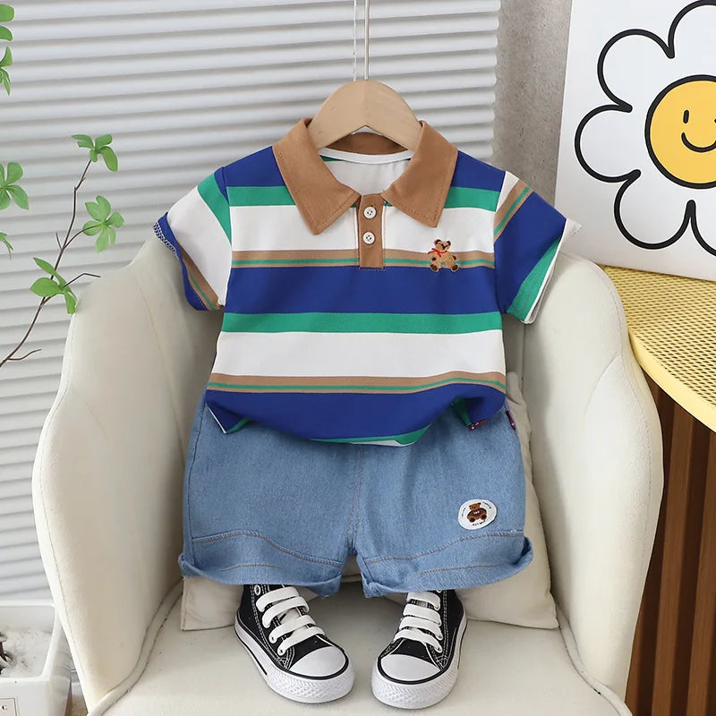 Get your little boy ready for summer with our Summer Toddler Boys Striped Bear Polo Shirt and Denim Shorts set.